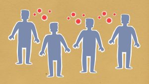Paper cutout silhouette of men placed together surrounded by contagious spreading red viruses on brown background during dangerous coronavirus outbreak